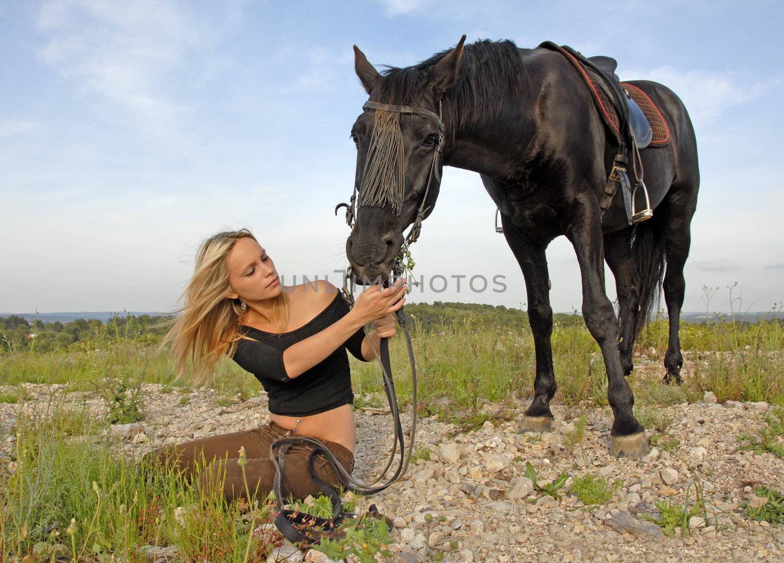 teenager and black stallion in nature by cynoclub