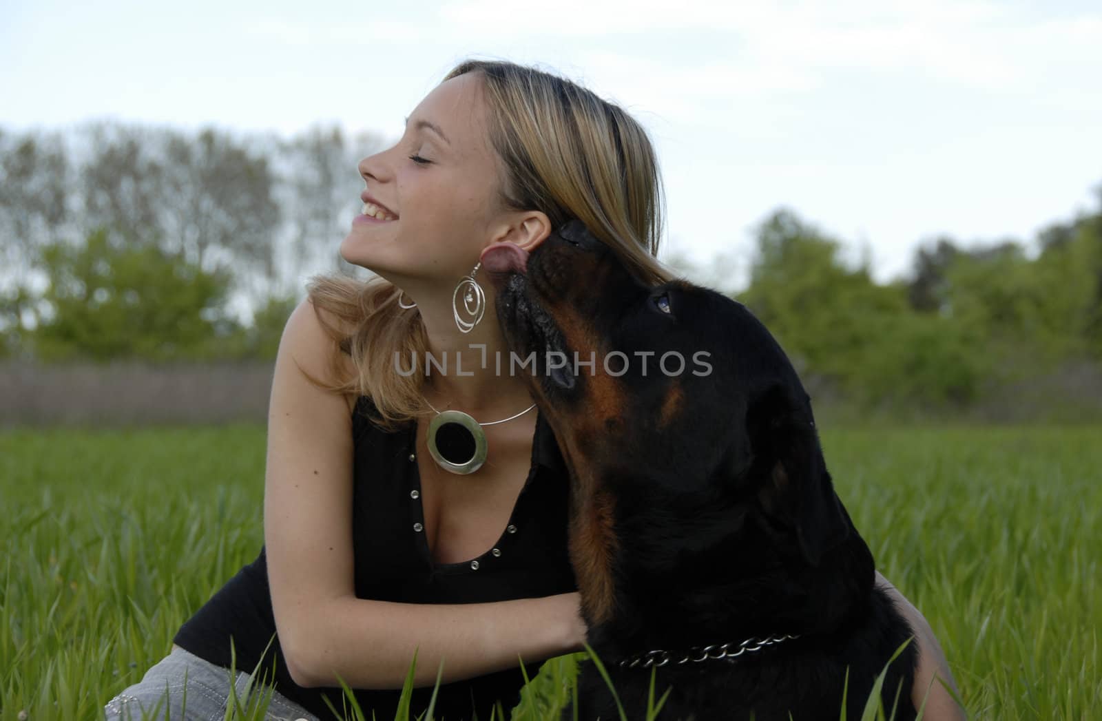 happy young teenager and her dog by cynoclub