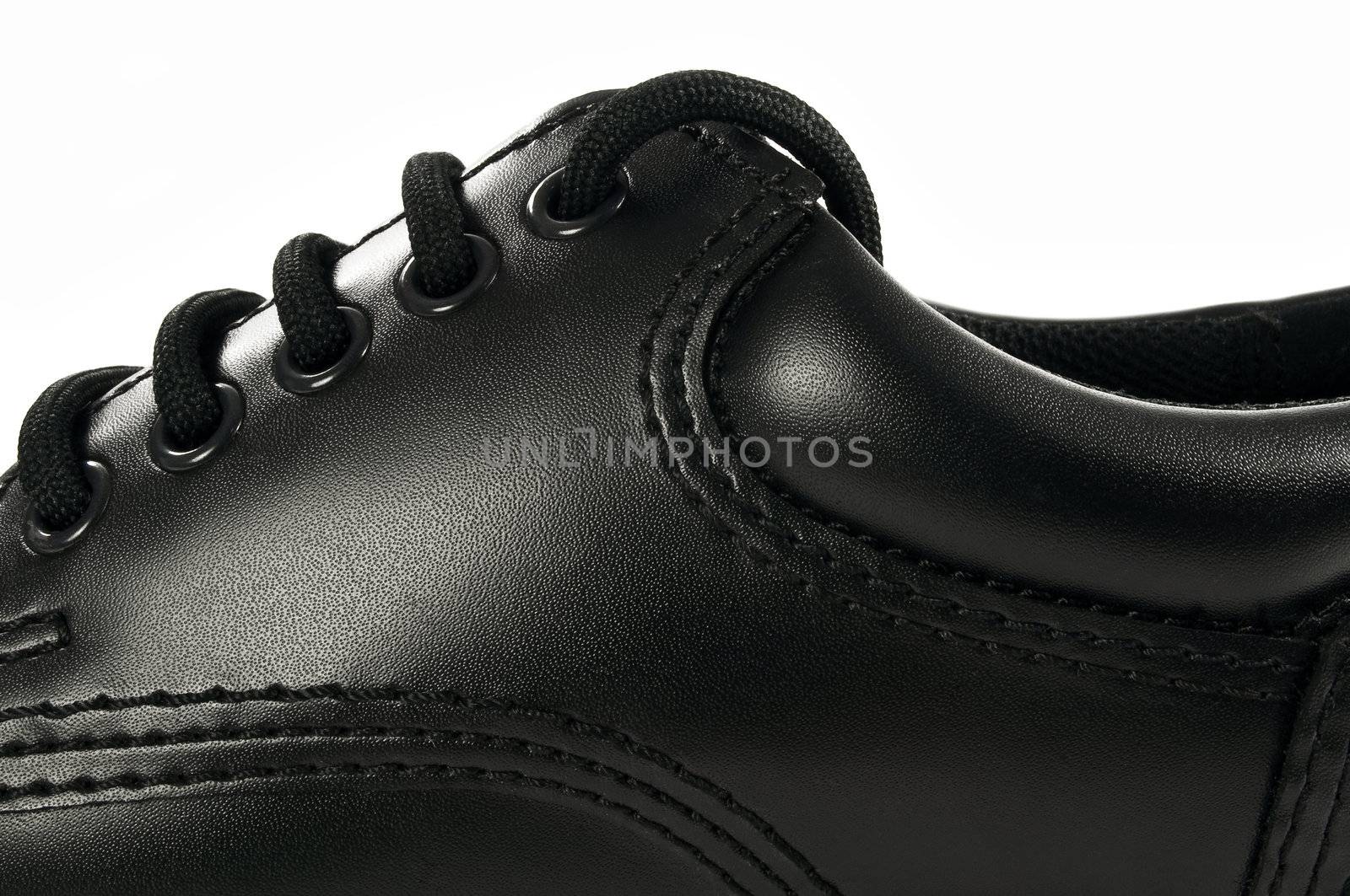 Detailed high resolution image of a black shoe.