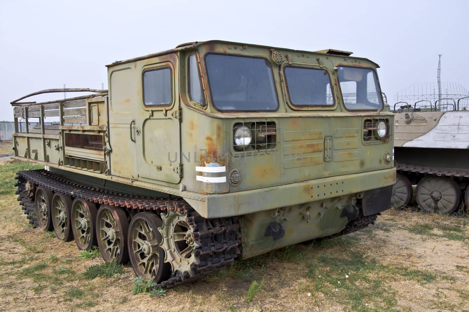 Old Army heavy all-terrain vehicle on tracks. Used to move goods and foot.