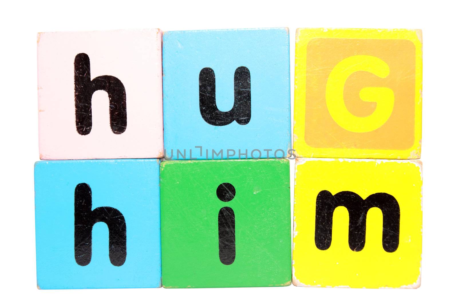 assorted childrens toy letter building blocks against a white background that spell hug him with clipping path