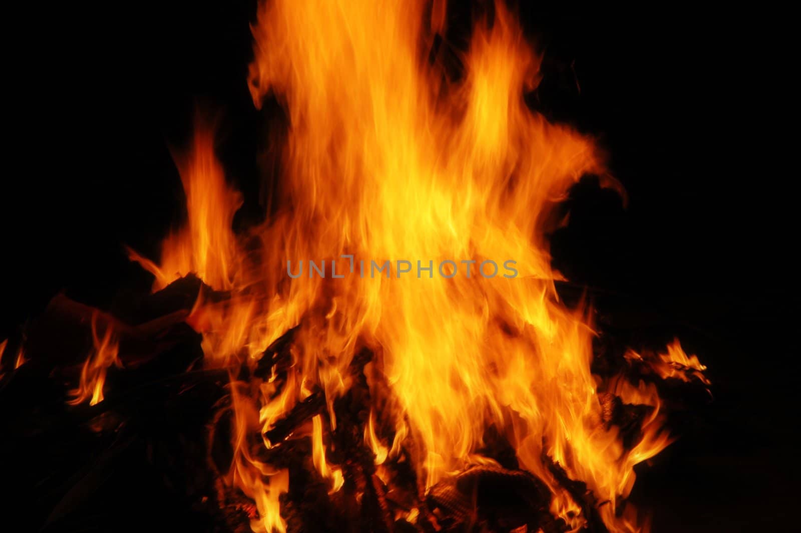 Fiery hot flame blazing with dark background