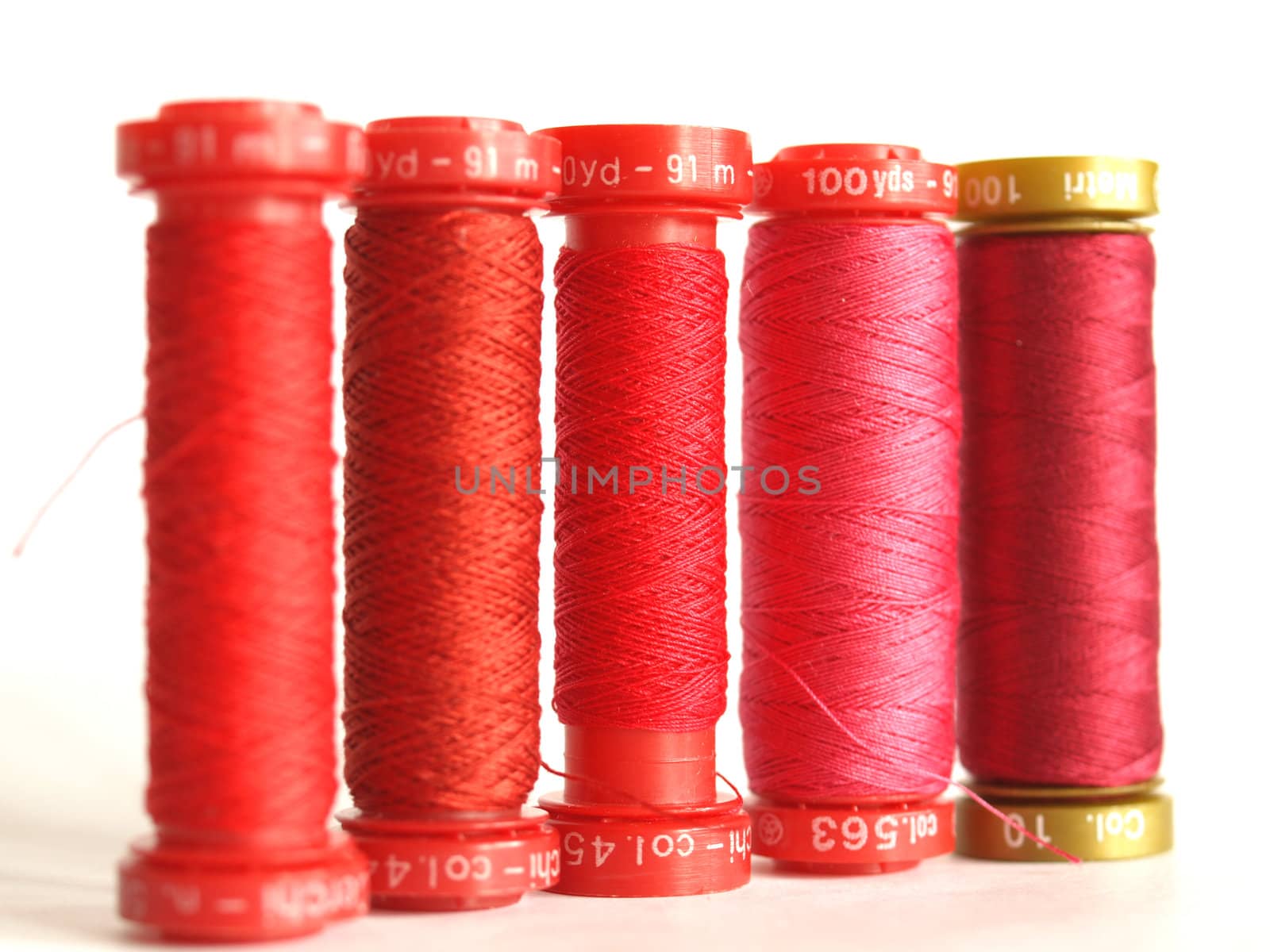 Red sewing threads spools