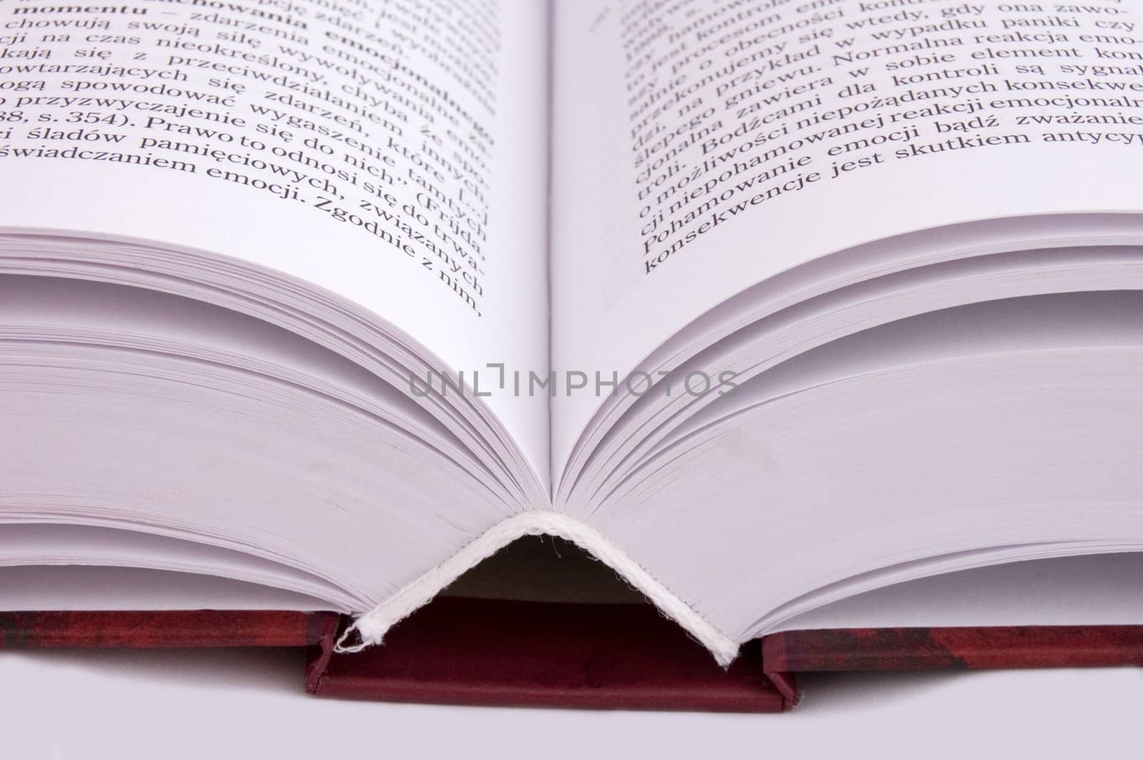 opened thick book isolated on white
