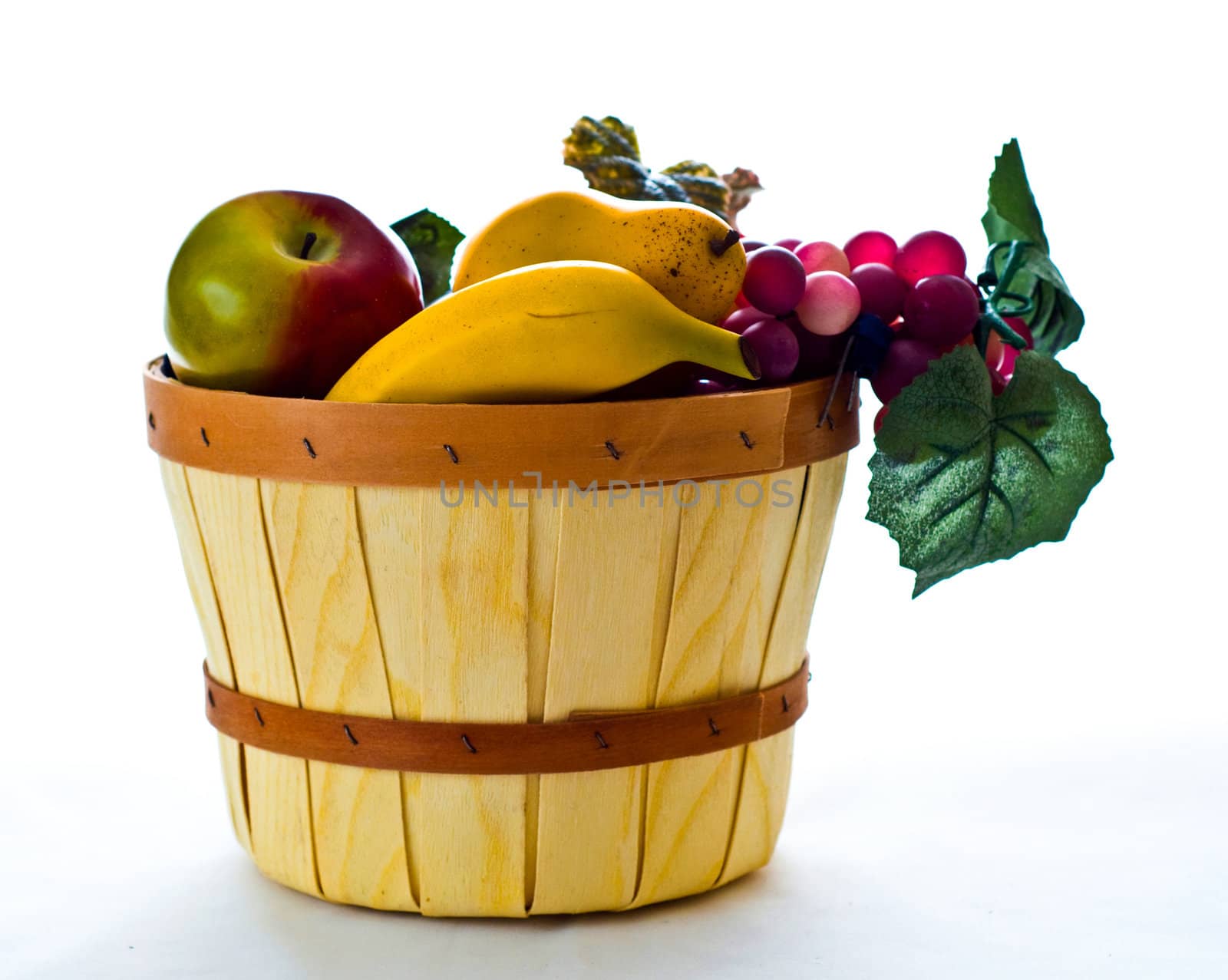 Assorted fruit arranged in a basket for a still life.