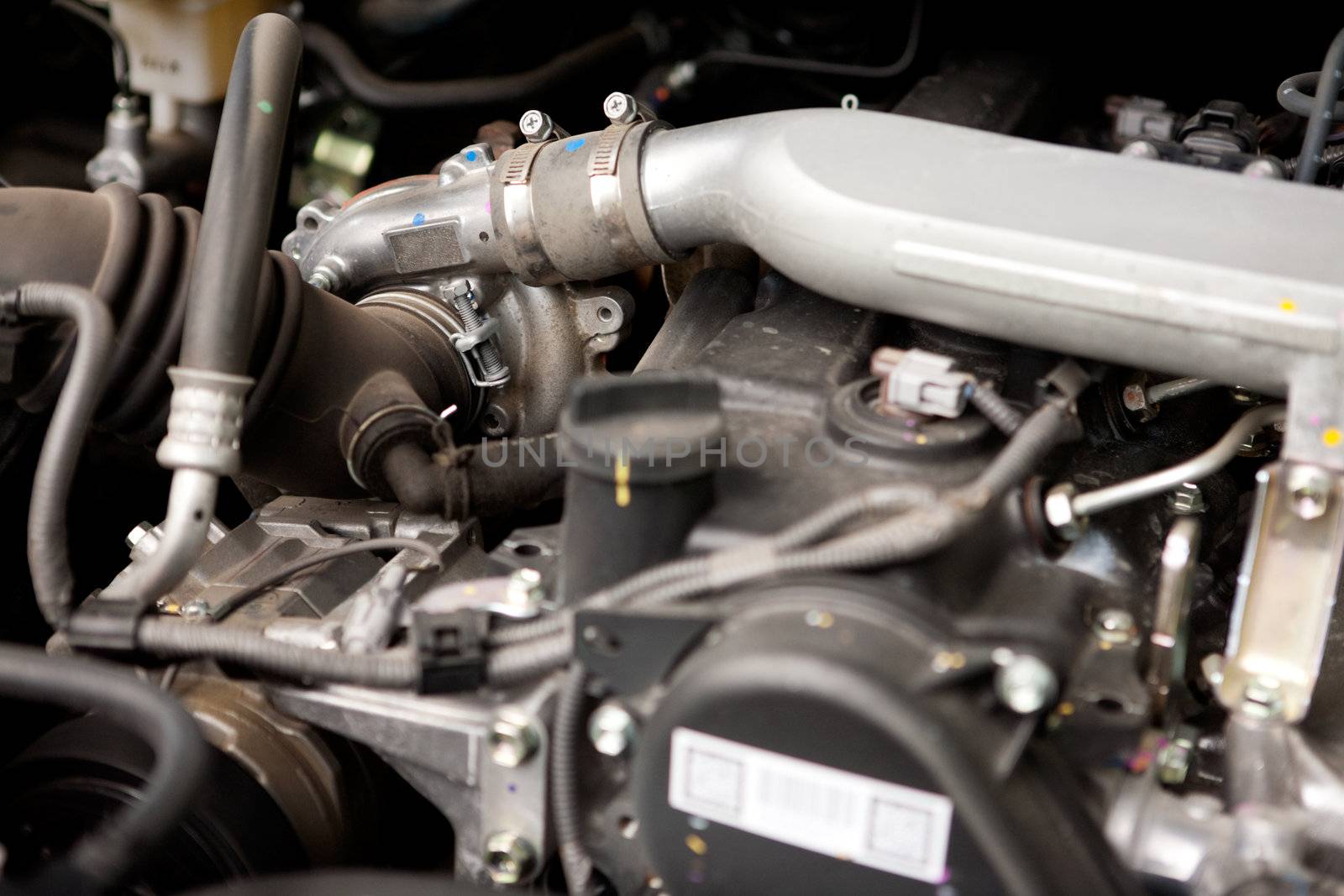 A detail of a diesel motor with focus on the turbo