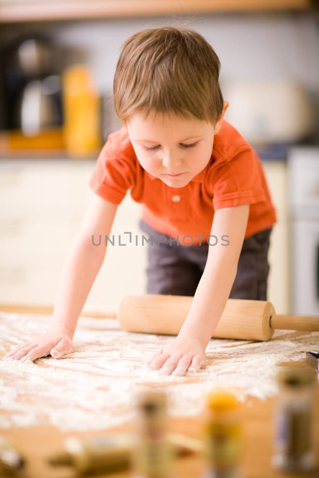 Boy baking cookies by shalamov