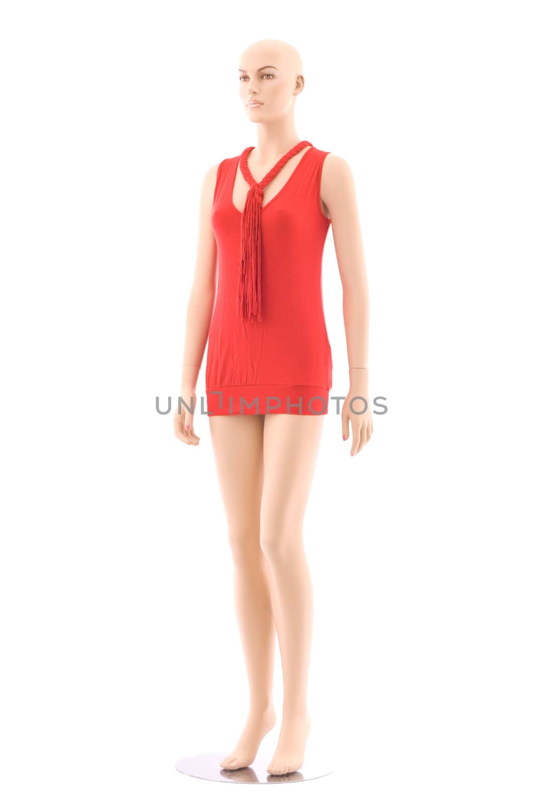 Bald female mannequin in red small clothing. Isolated on white background