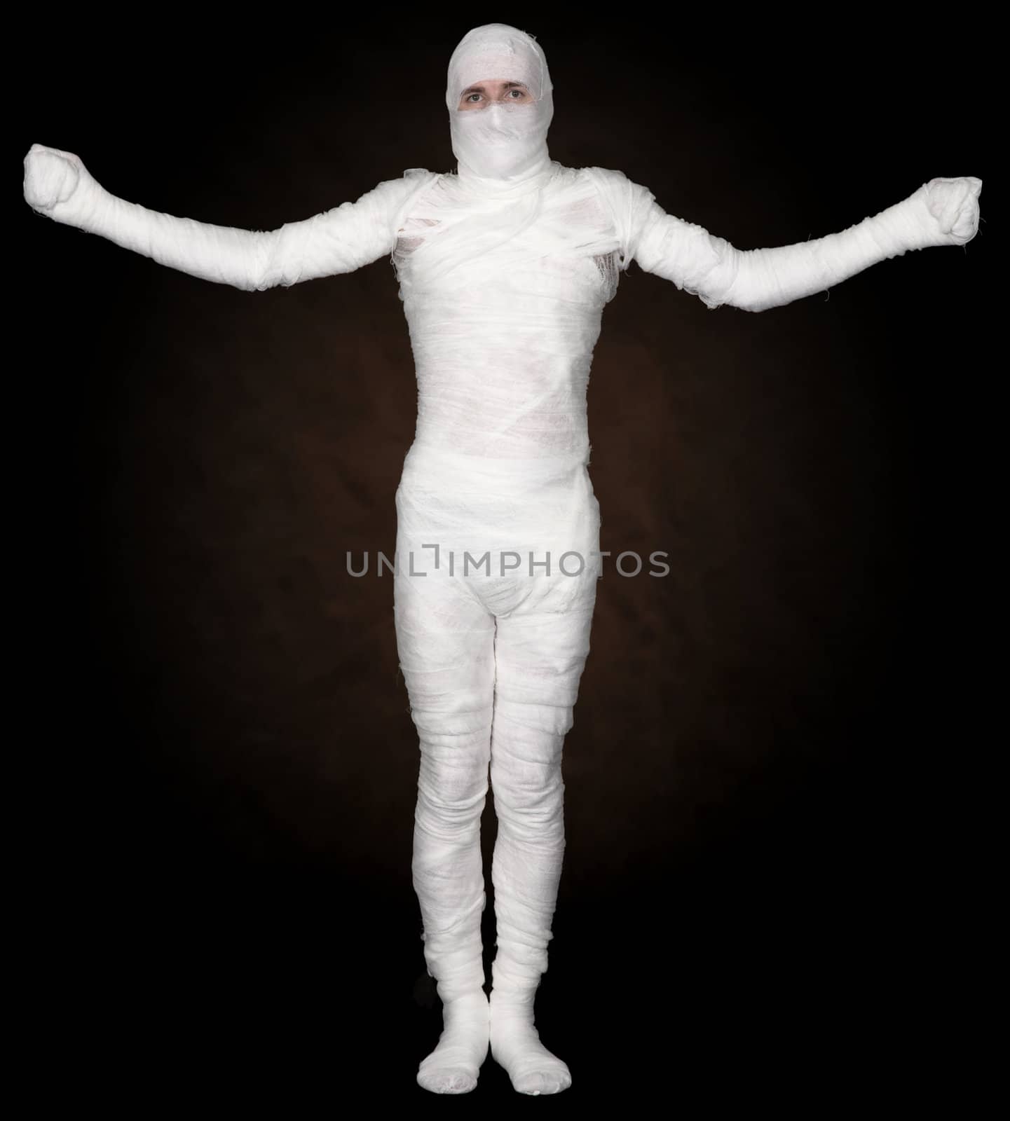 Man in bandage on the black background