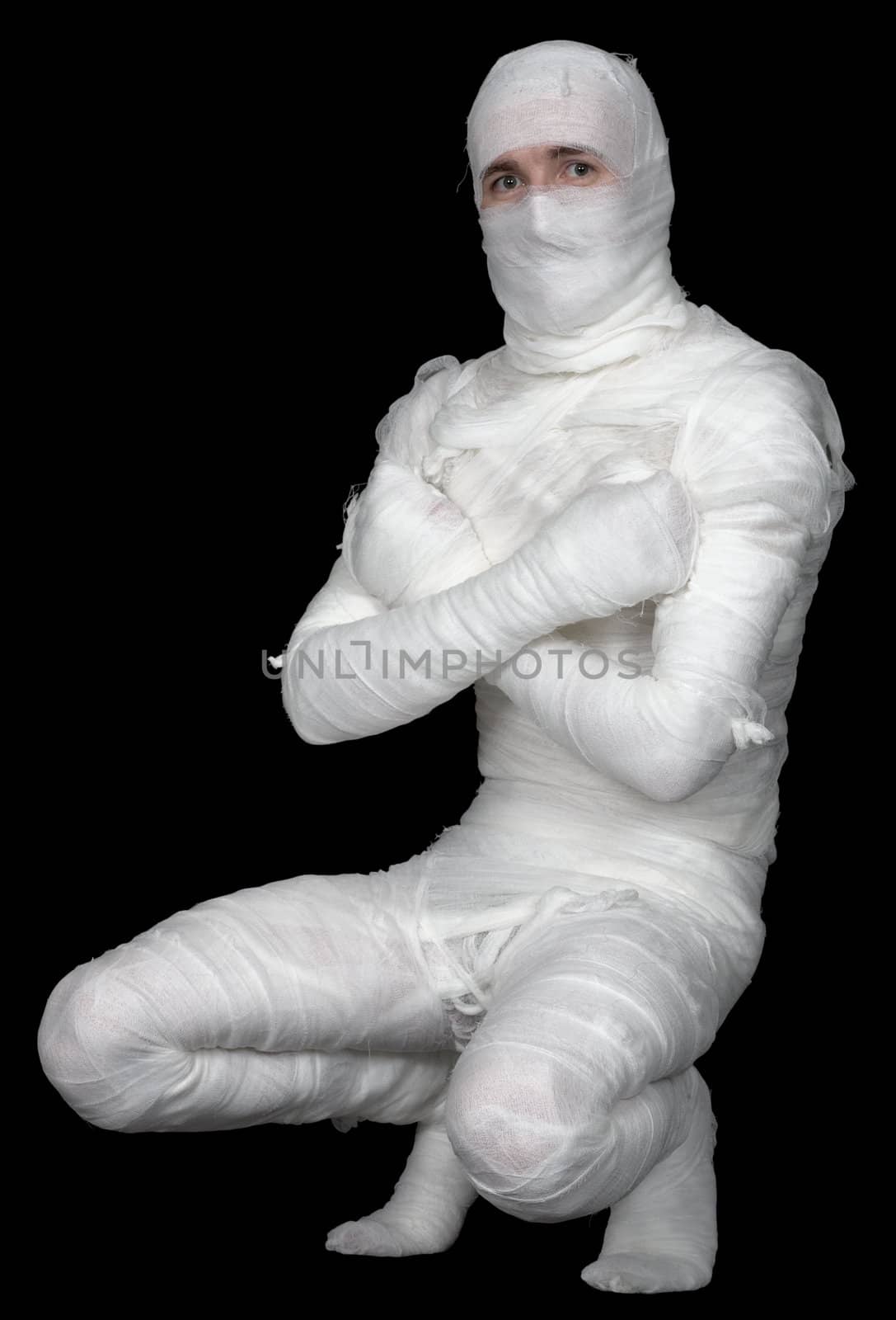 Man in bandage on the black background