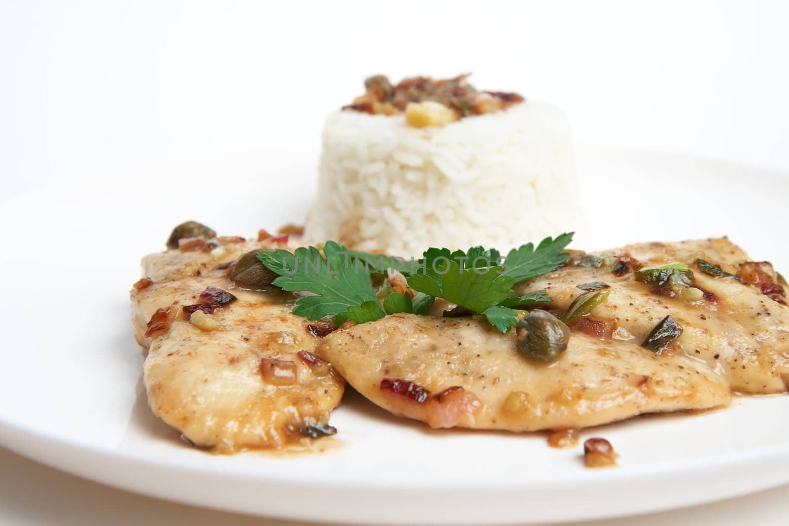 Chicken picatta with rice, shallow DOF