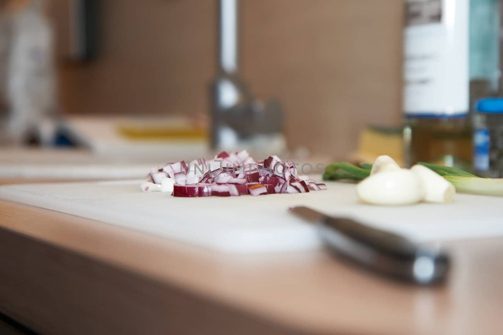 Chopped onions on a board, extremely shallow DOF