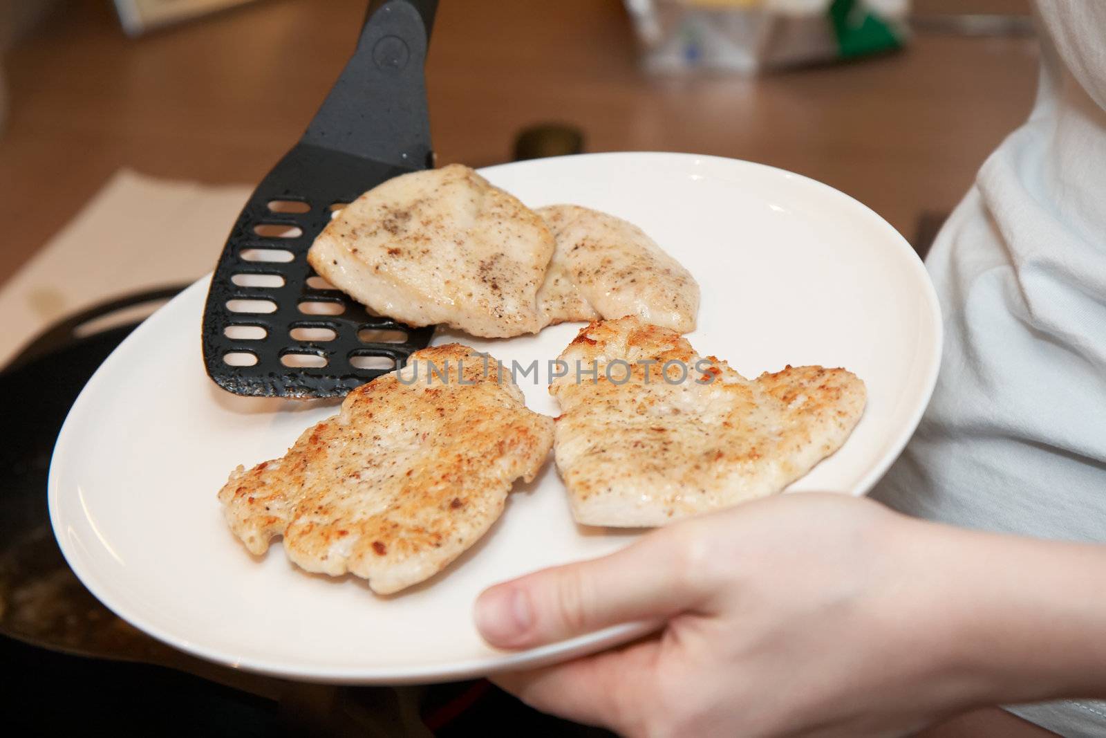 chicken cutlets on a plate, shallow DOF