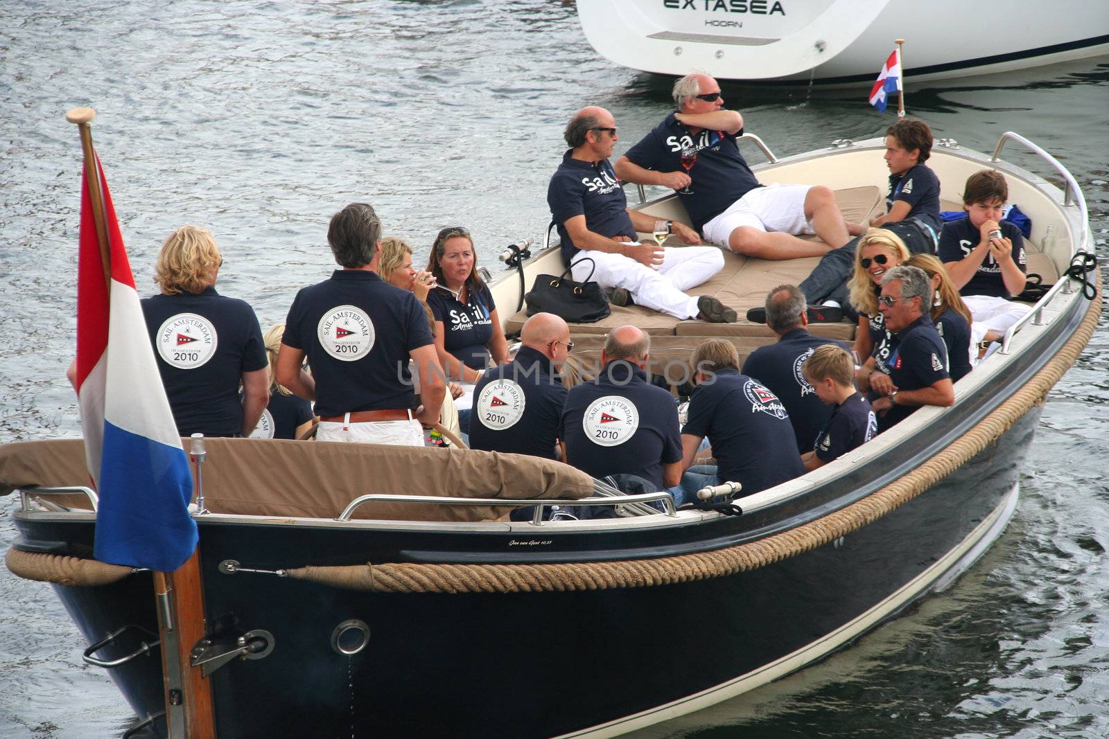 AMSTERDAM, AUGUST 19, 2010: Organization crew in a sloop at Sail 2010 in Amsterdam, Holland on august 19, 2010