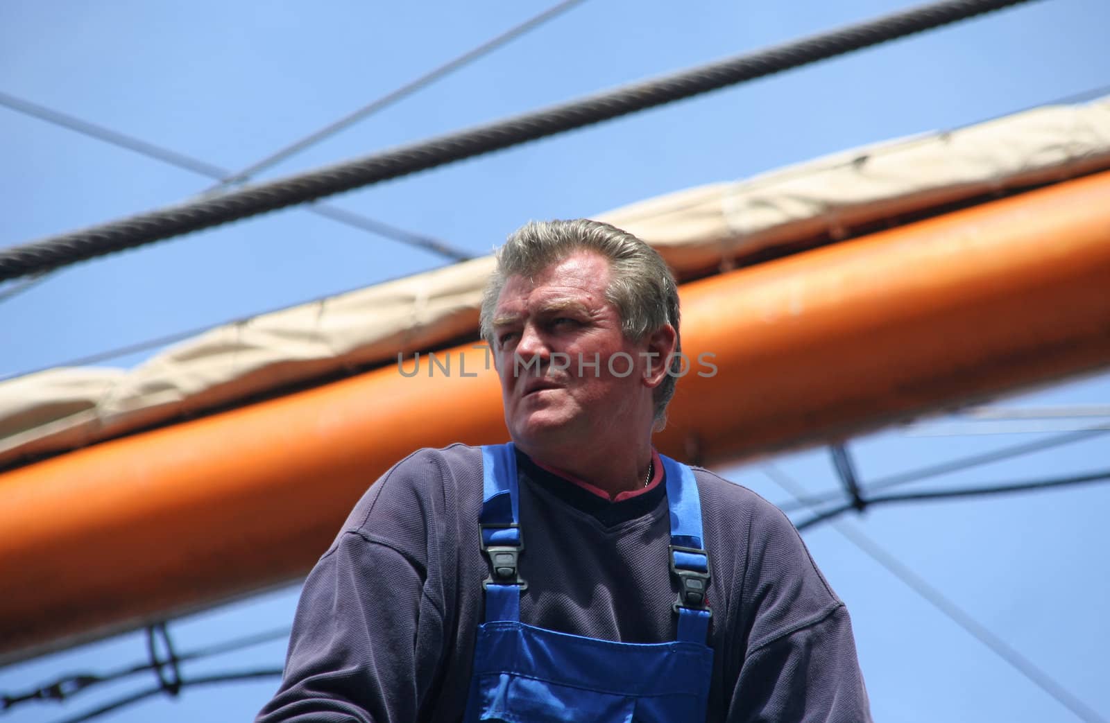 AMSTERDAM, AUGUST 19, 2010: Bos'n overseeing the mooring of the Russian tall ship Sedov to the quay at Sail 2010 in Amsterdam, Holland on august 19, 2010