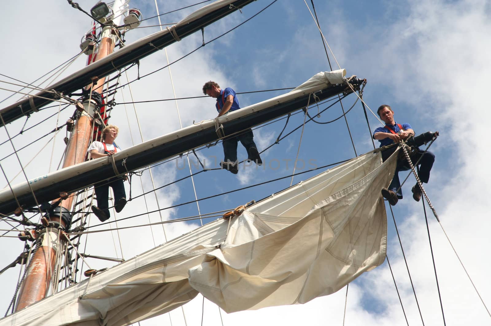 AMSTERDAM, AUGUST 19, 2010: Sailers in the mast of Dutch tall ship Stad Amsterdam at Sail 2010 in Amsterdam, Holland on august 19, 2010