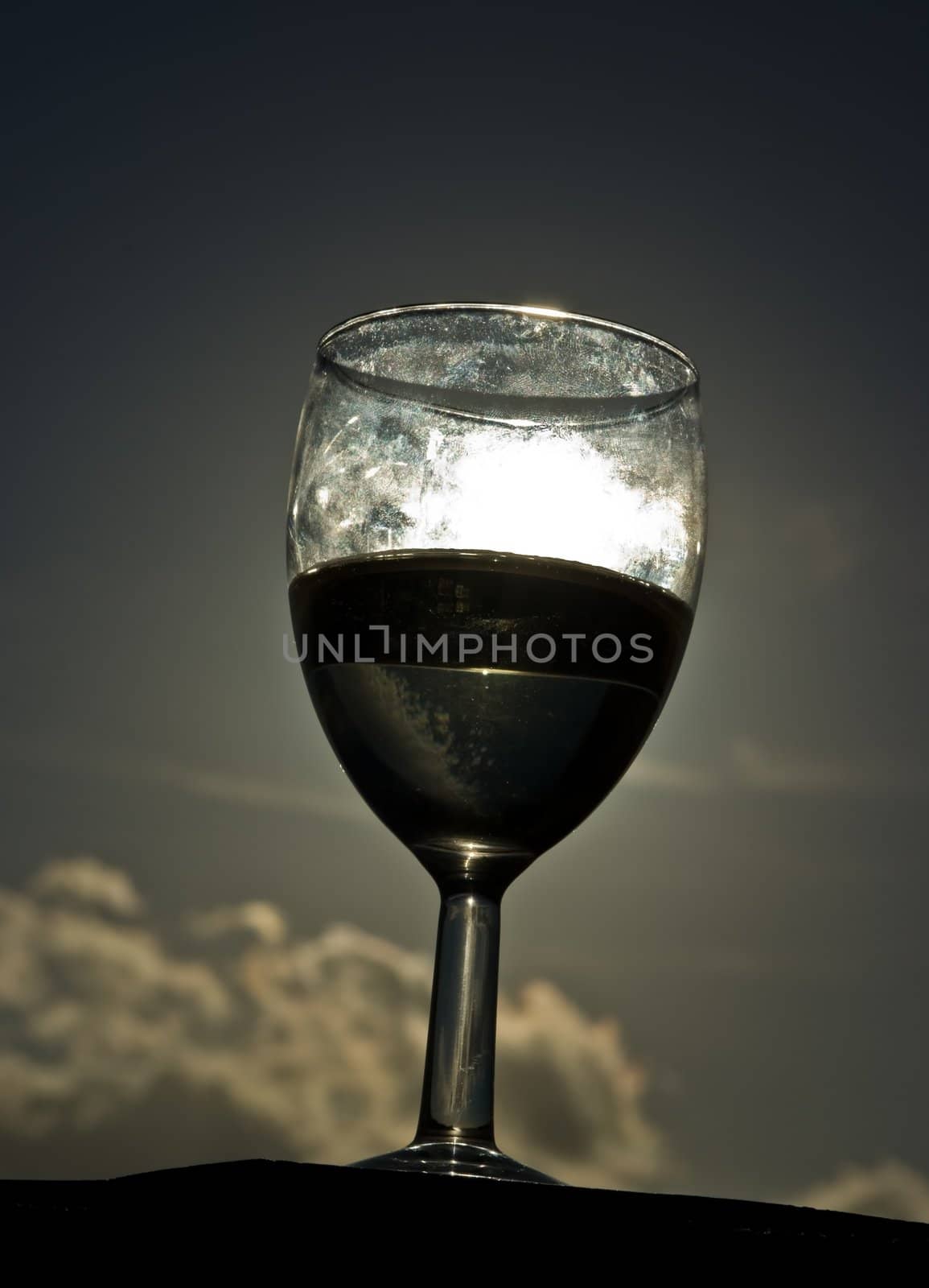 A glass of white house wine, taken at sunset on Madeira, Portugal.
