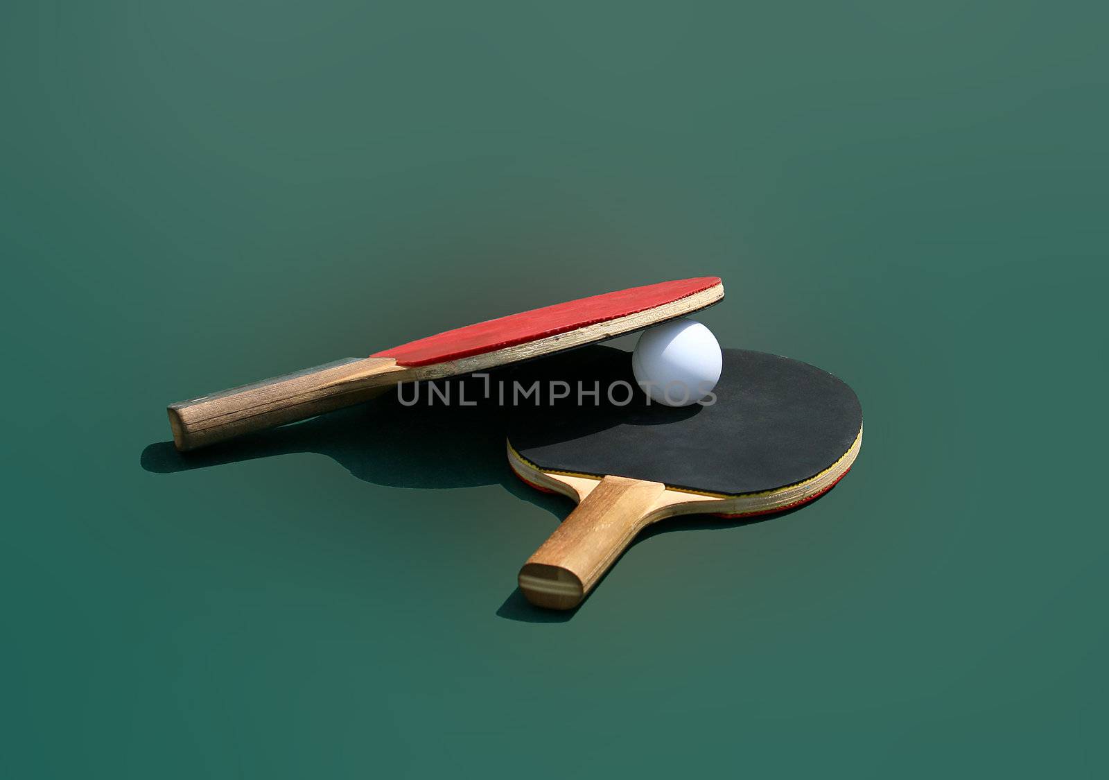 table tennis rackets isolated on green