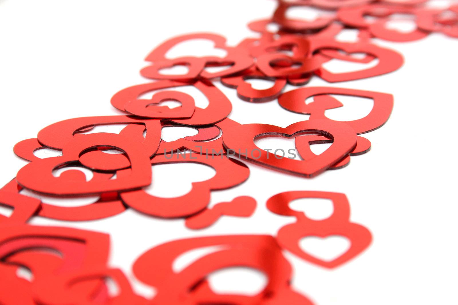 heart shaped confetti on white background