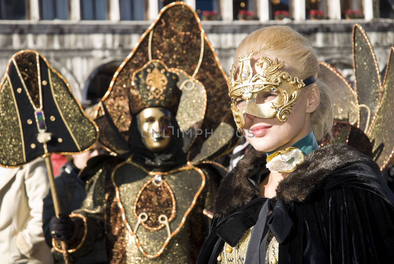 Traditionally dressed Venice carnival  female performer in Piazza San Marco, Italy