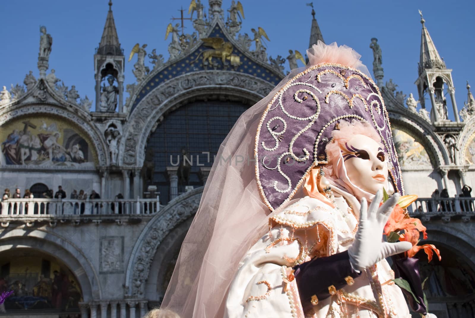 Traditionally dressed Venice carnival  female performer in Piazza San Marco, Italy