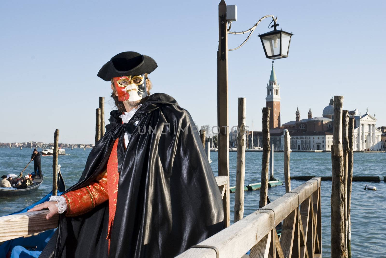 Traditionally dressed Venice carnival  male performer in Piazza San Marco, Italy