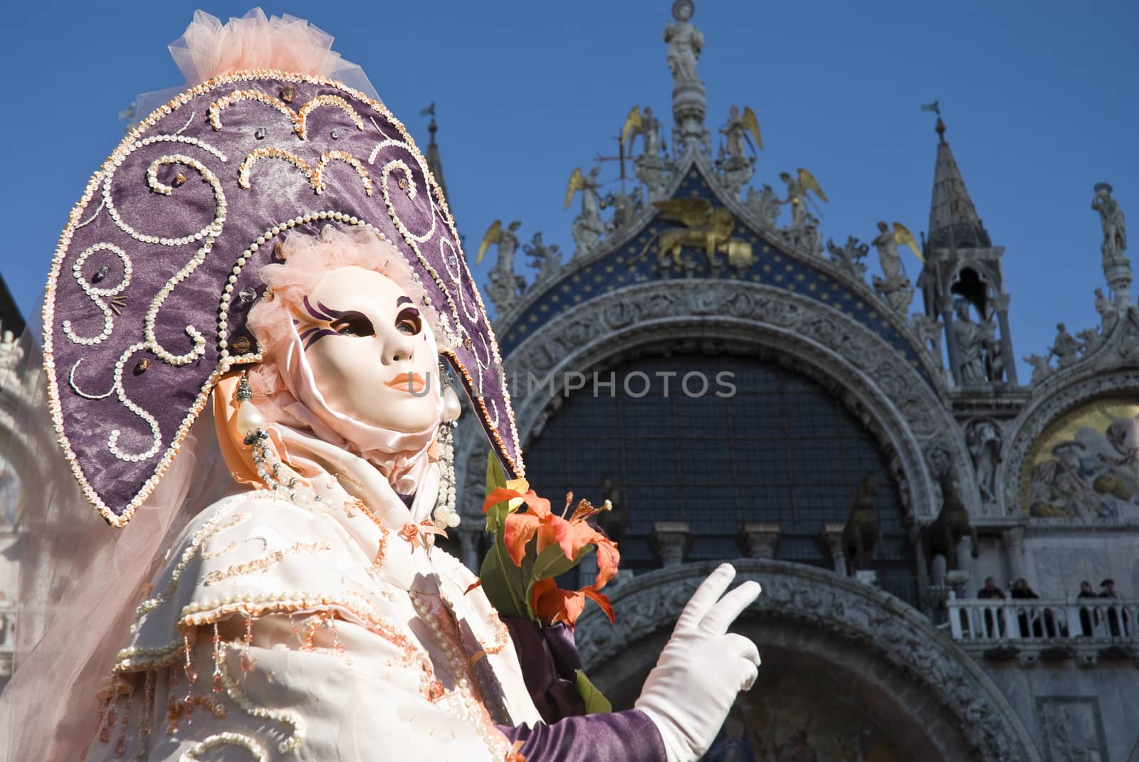 Traditionally dressed Venice carnival  female performer in Piazza San Marco, Italy