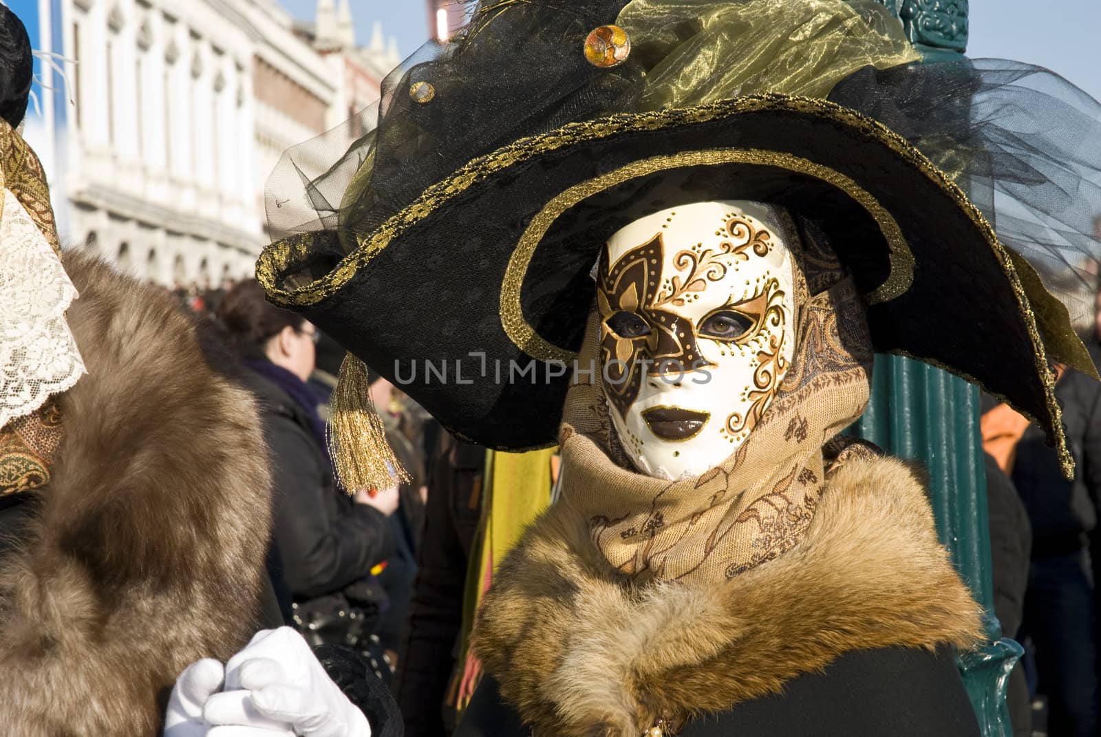 Traditionally dressed Venice carnival  female performer in Piazza San Marco, Italy