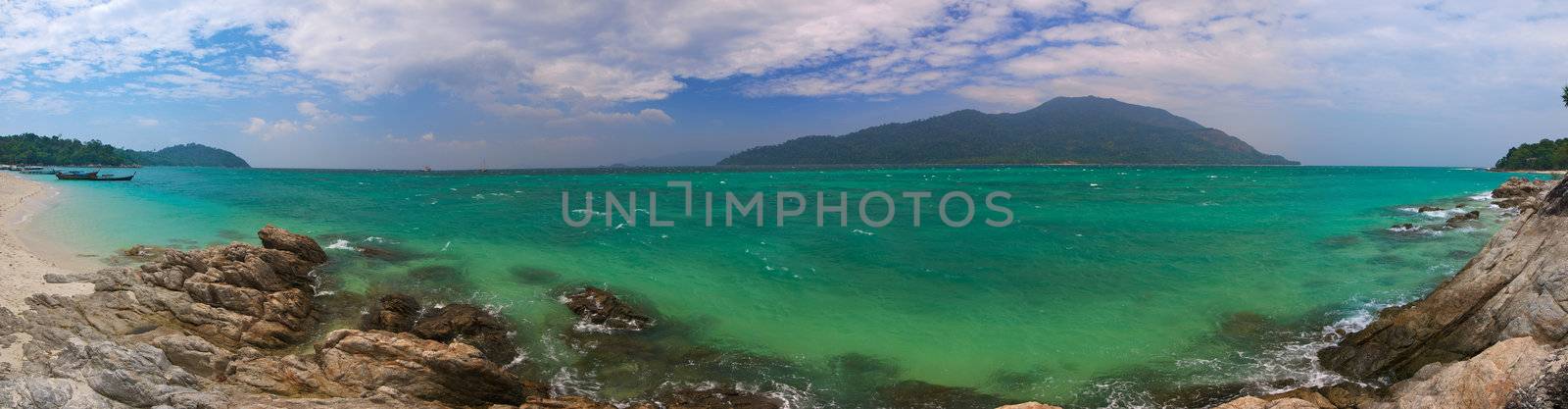 High resolution panoramic image of the tropical sea, with shoreline and island