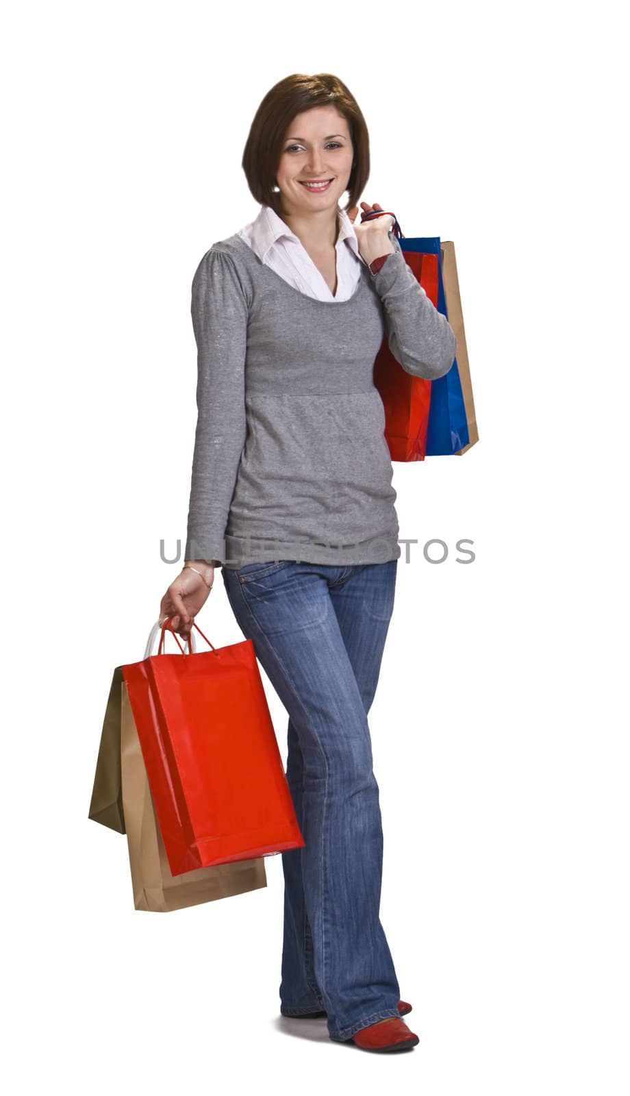 Young casual woman with shopping bags.