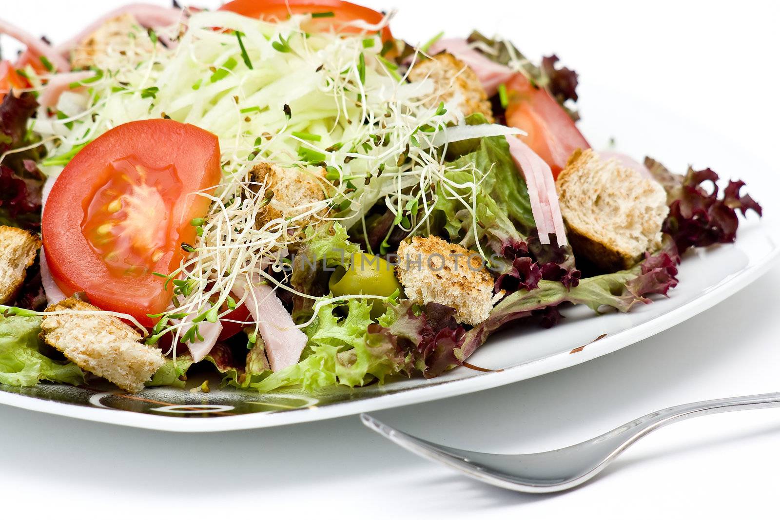 appetizing healthy salad on a plate by miradrozdowski