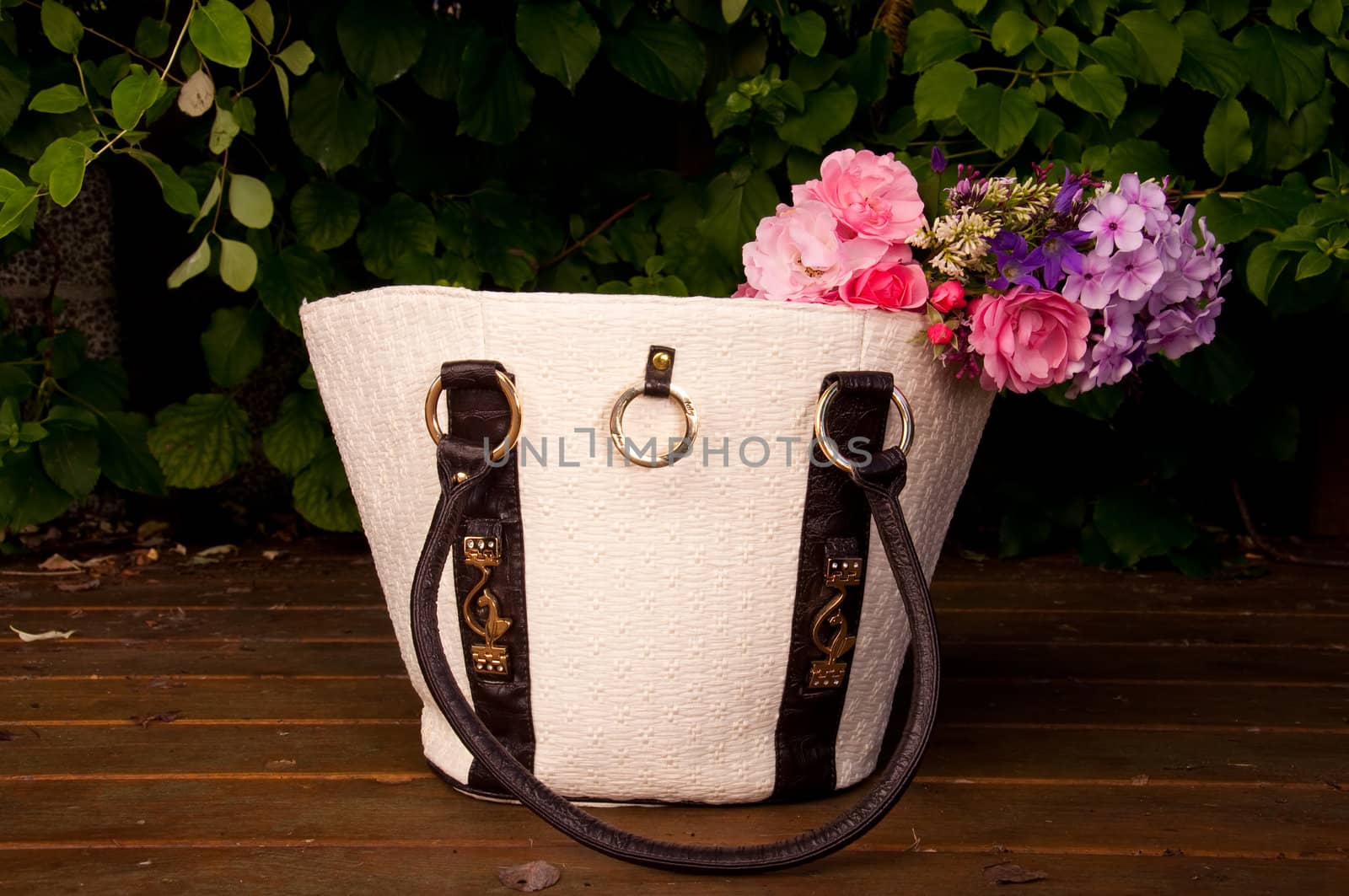 Female bag with fresh flowers by GryT