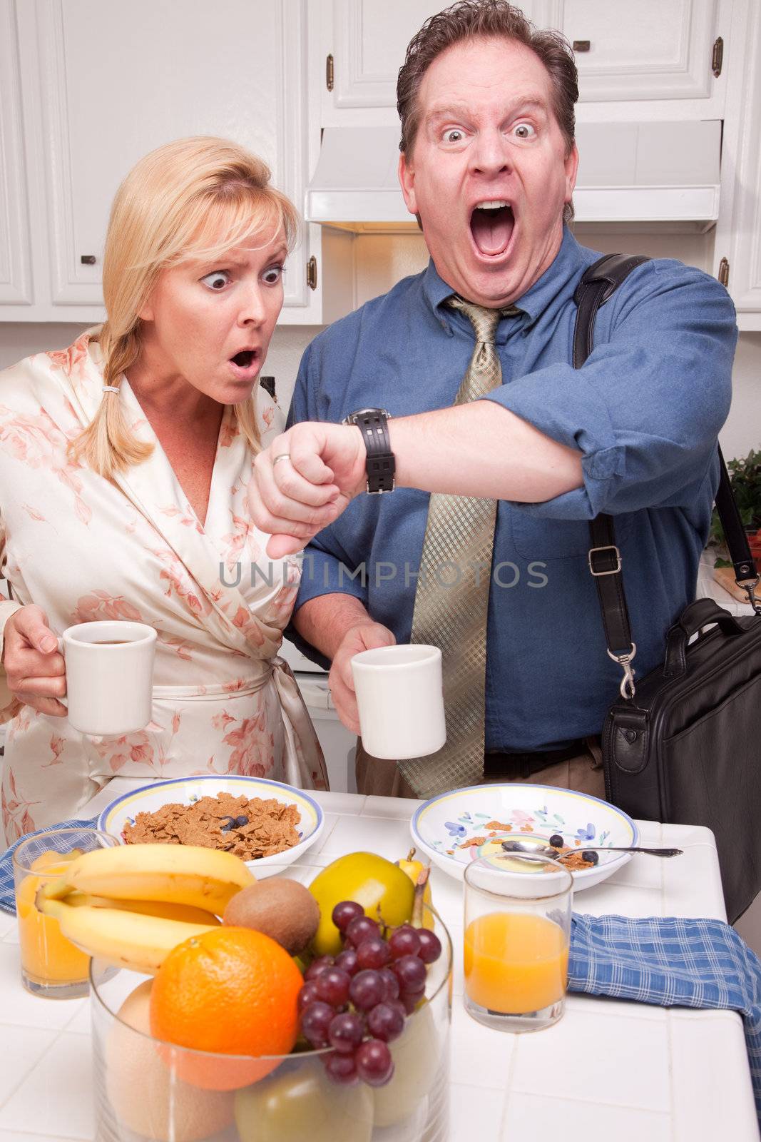 Late for Work Stressed Couple Checking Time in Kitchen.