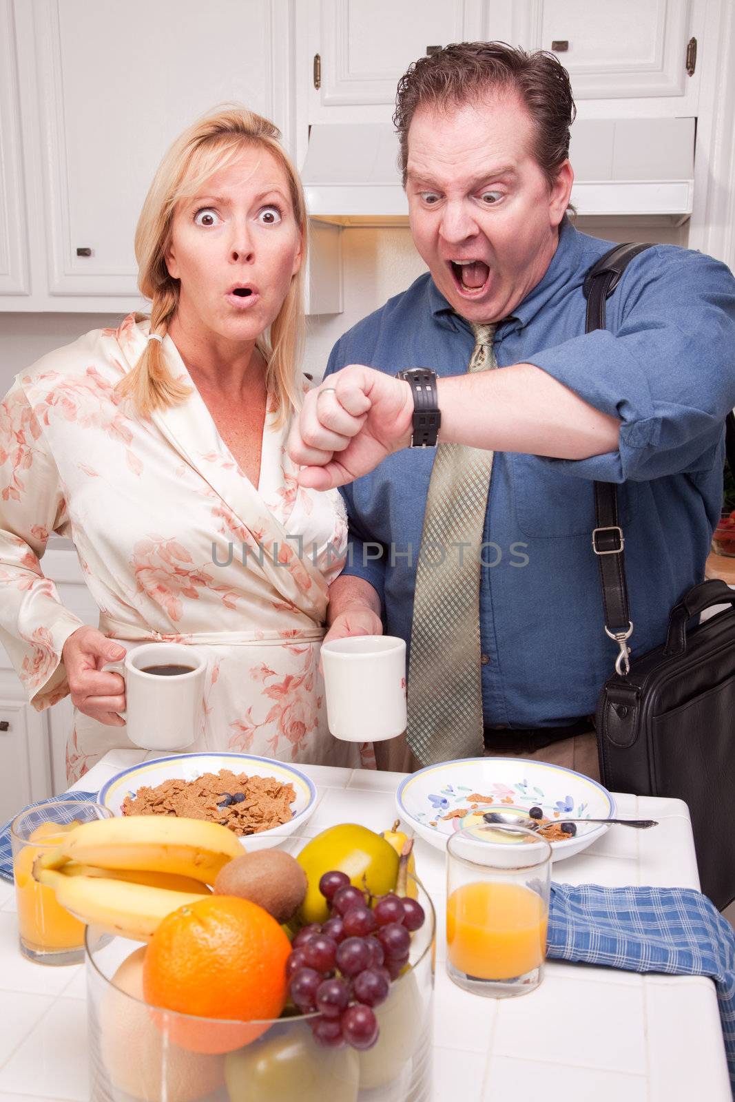 Late for Work Stressed Couple Checking Time in Kitchen.