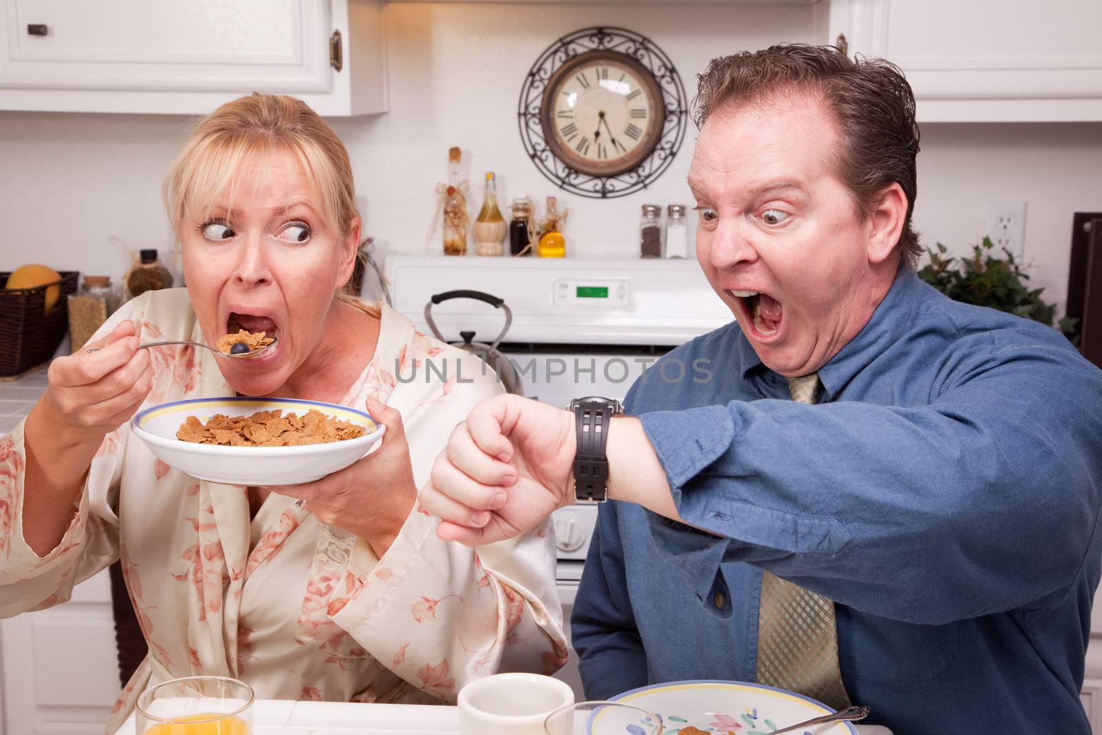 Late for Work Stressed Couple Checking Time in Kitchen.