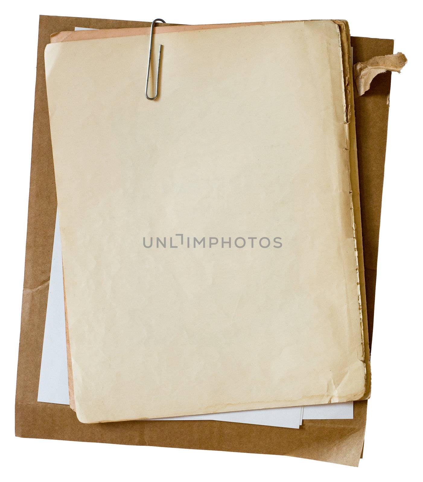 Metalic paper clip on stack of old papers. Clipping path included