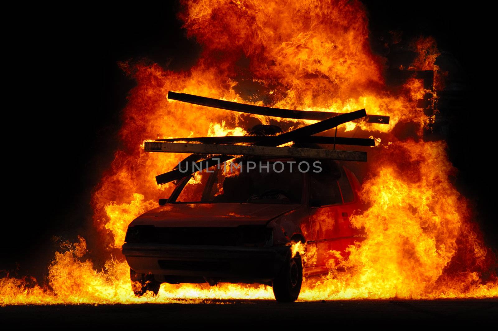 Car is driving through fire