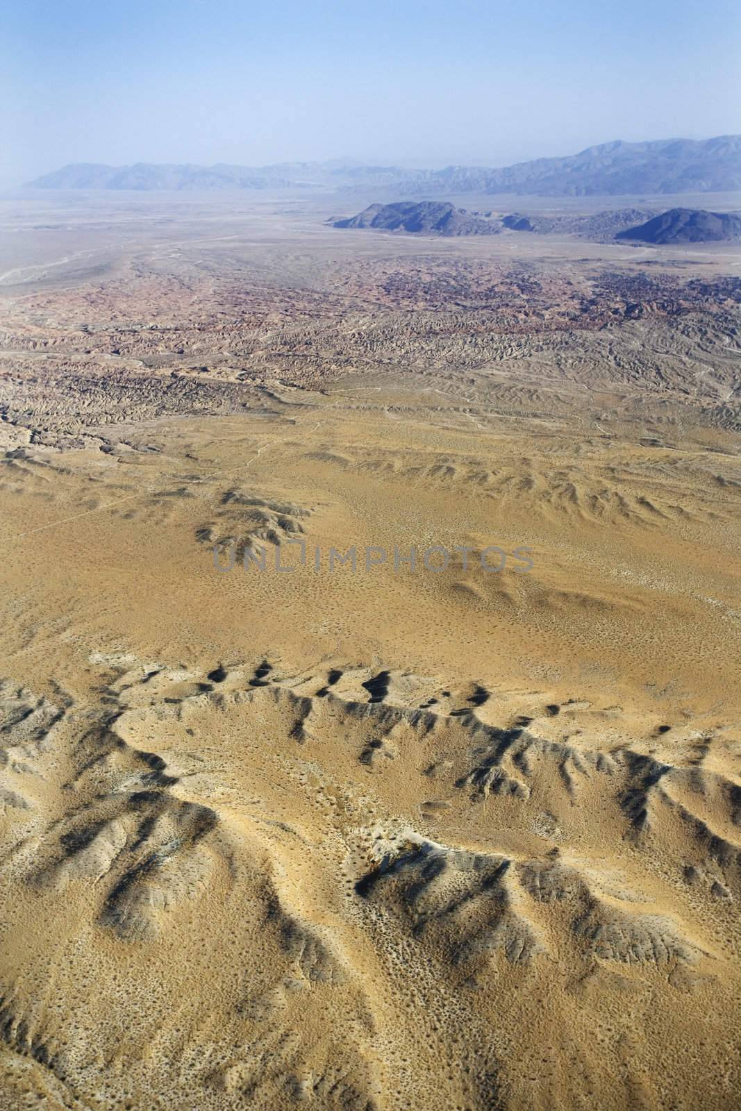 Aerial view of mountainous desert landscape.
