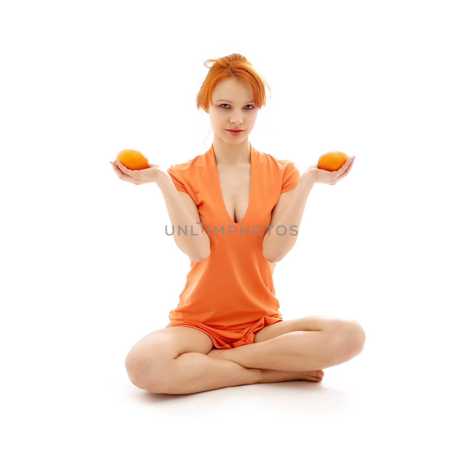 lovely redhead with two oranges over white