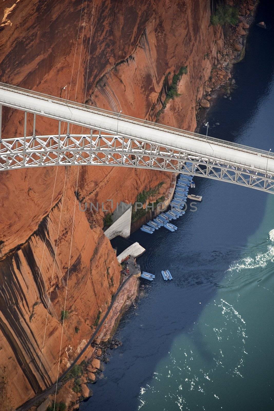 Aerial of Glen Canyon Dam Bridge over river gorge in Arizona, USA.