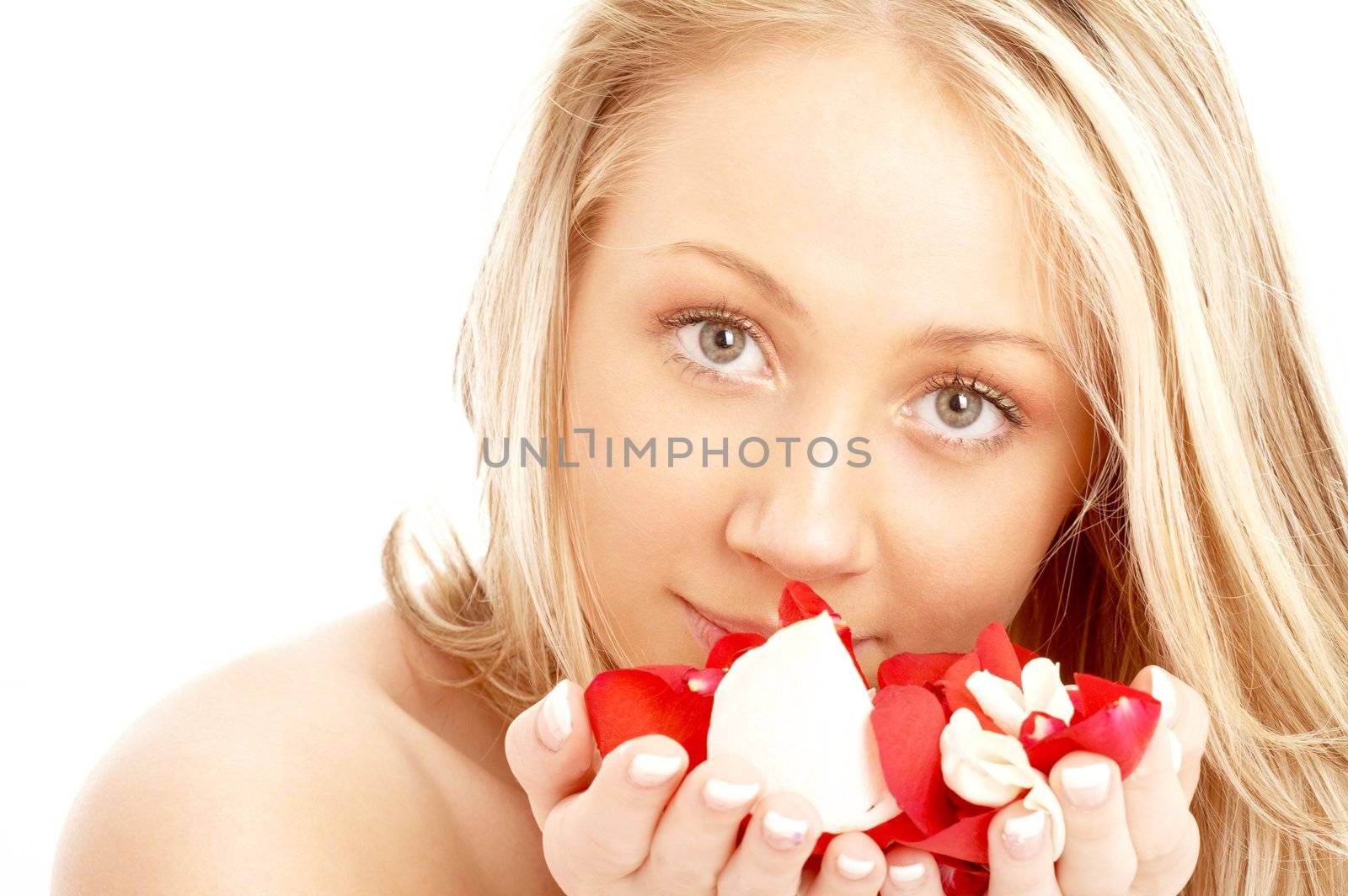 happy blond in spa with red and white petals by dolgachov