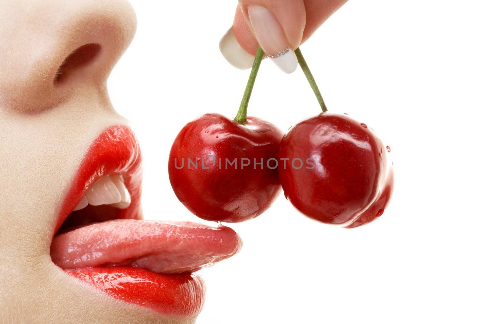 picture of cherry, lips and tongue over white