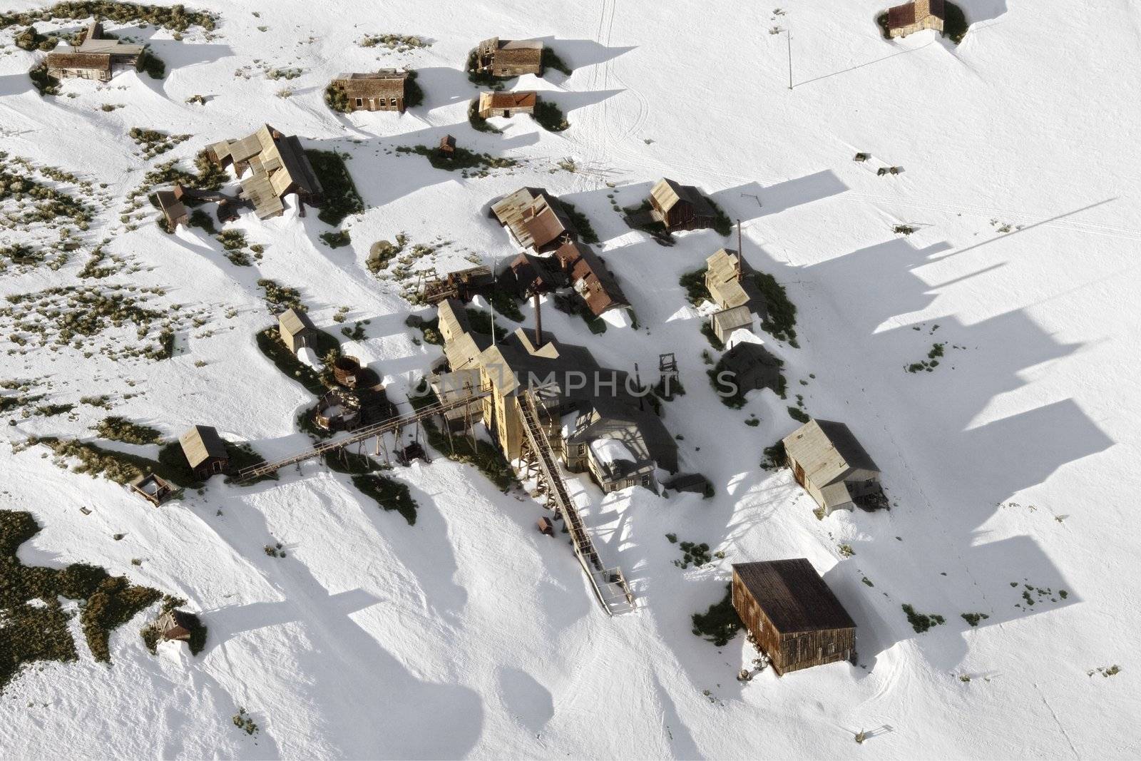 Aerial of snow covered buildings in small town, California, USA.