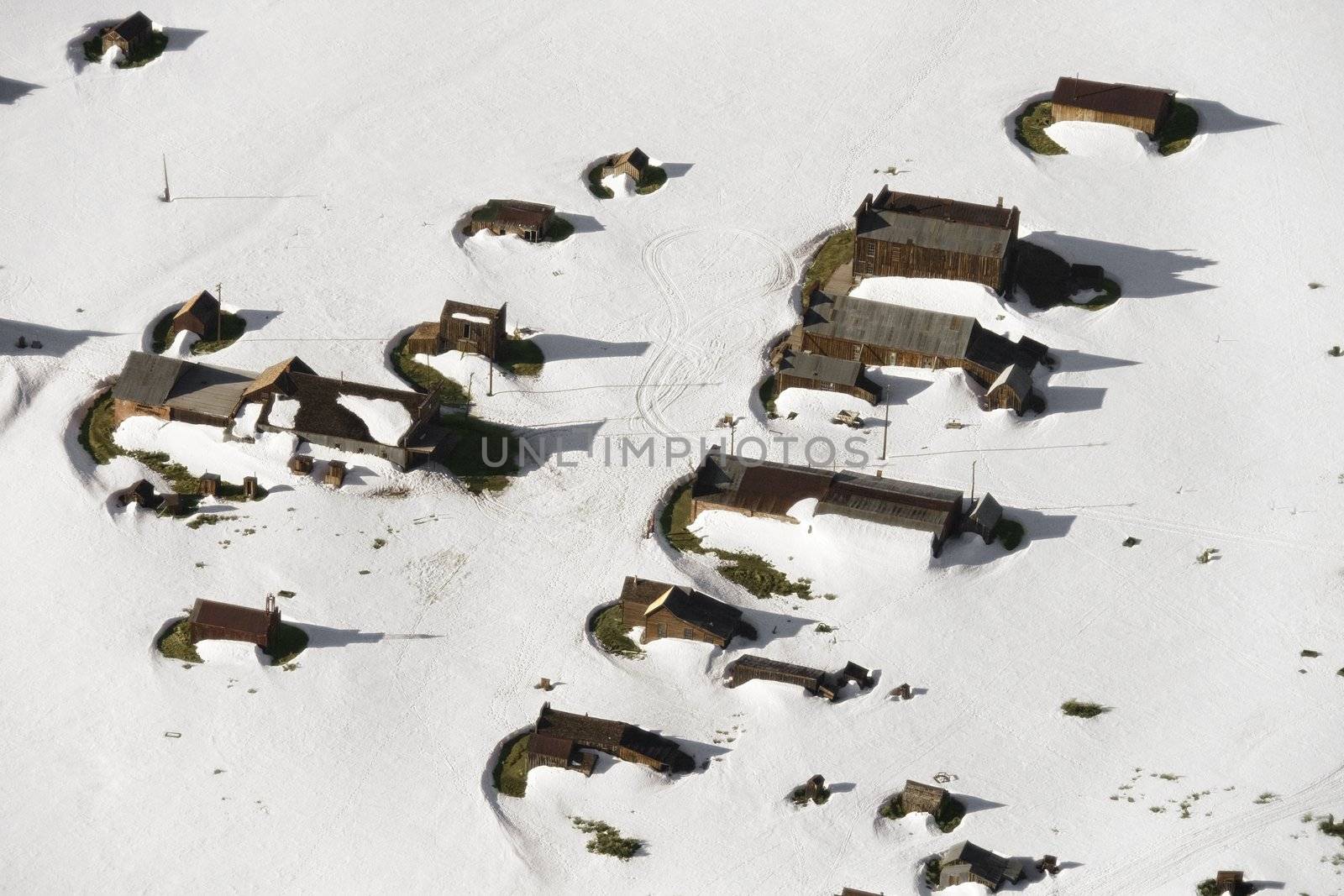 Aerial of snow covered buildings in small town, California, USA.