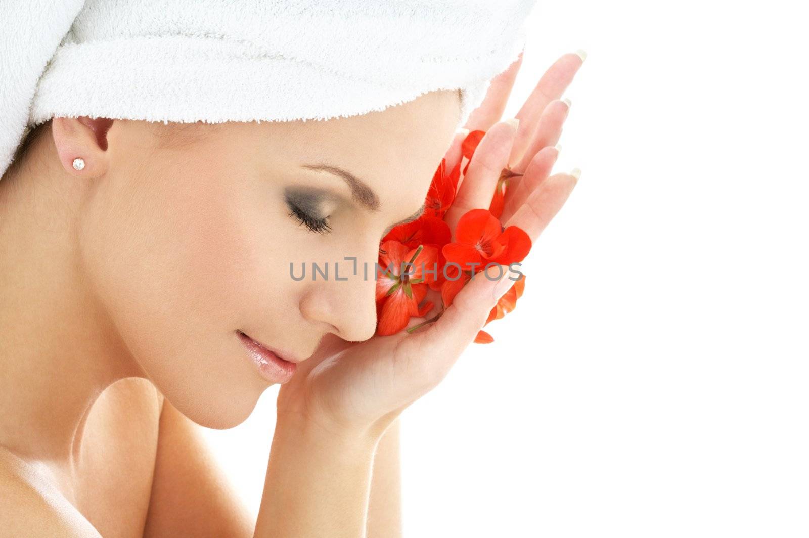 happy woman with red flower petals in spa
