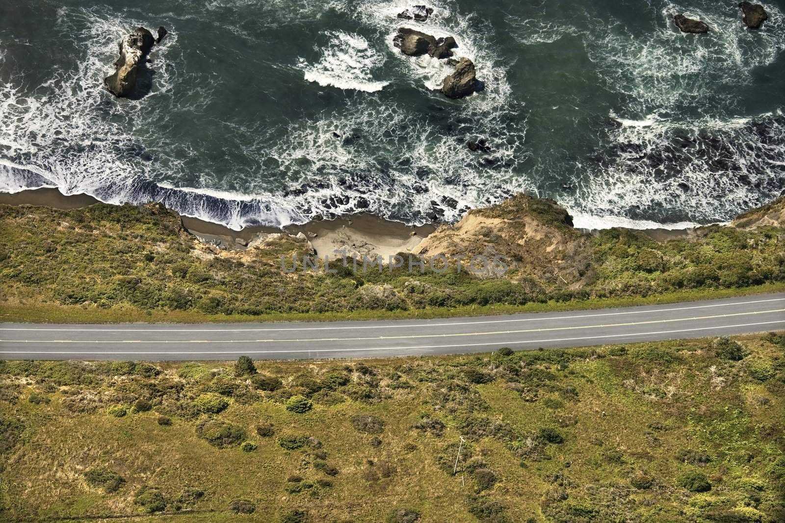 Aerial of coastal scenic highway along Pacific Ocean on California west coast, USA.