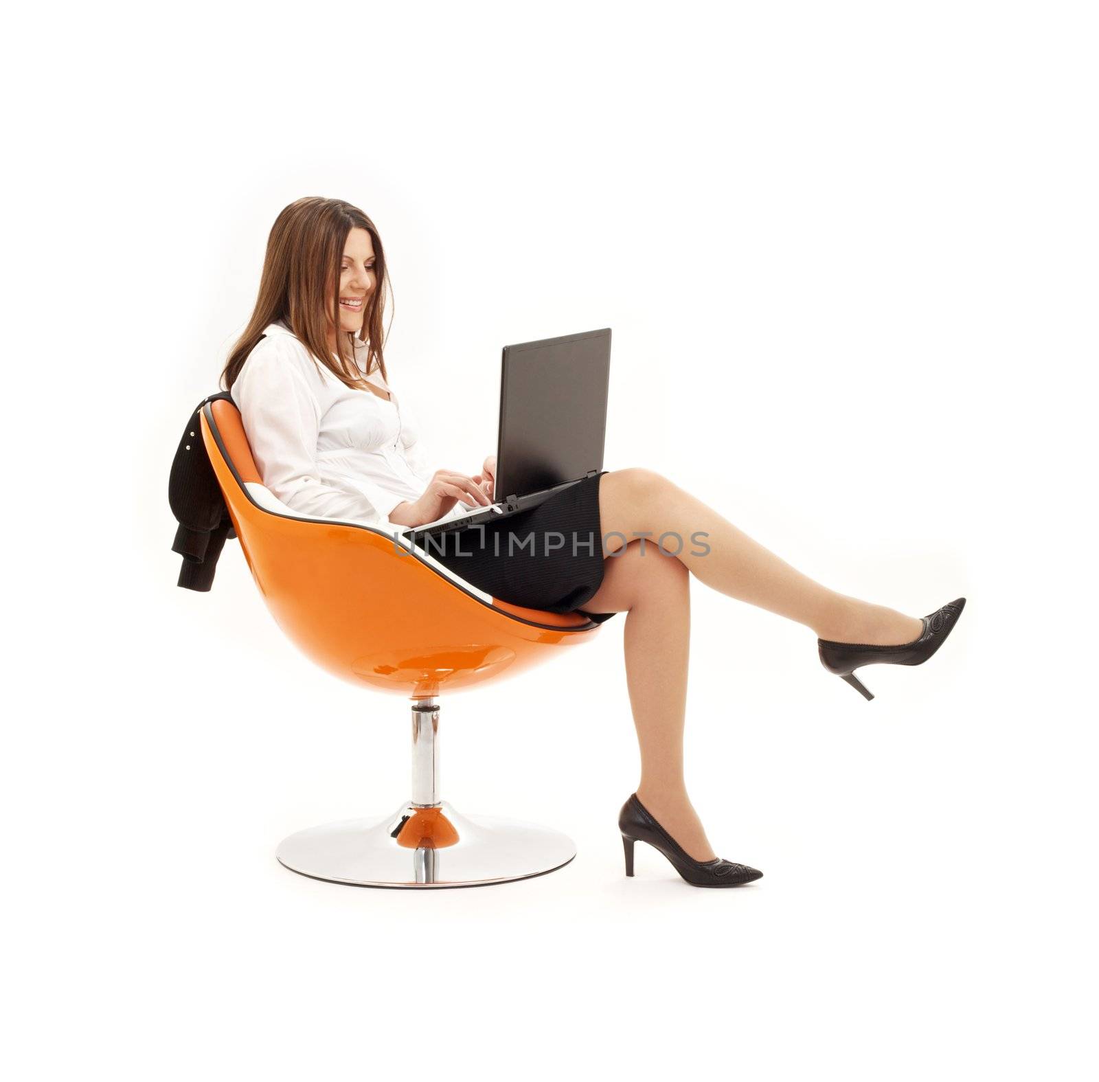 businesswoman with laptop in orange chair by dolgachov