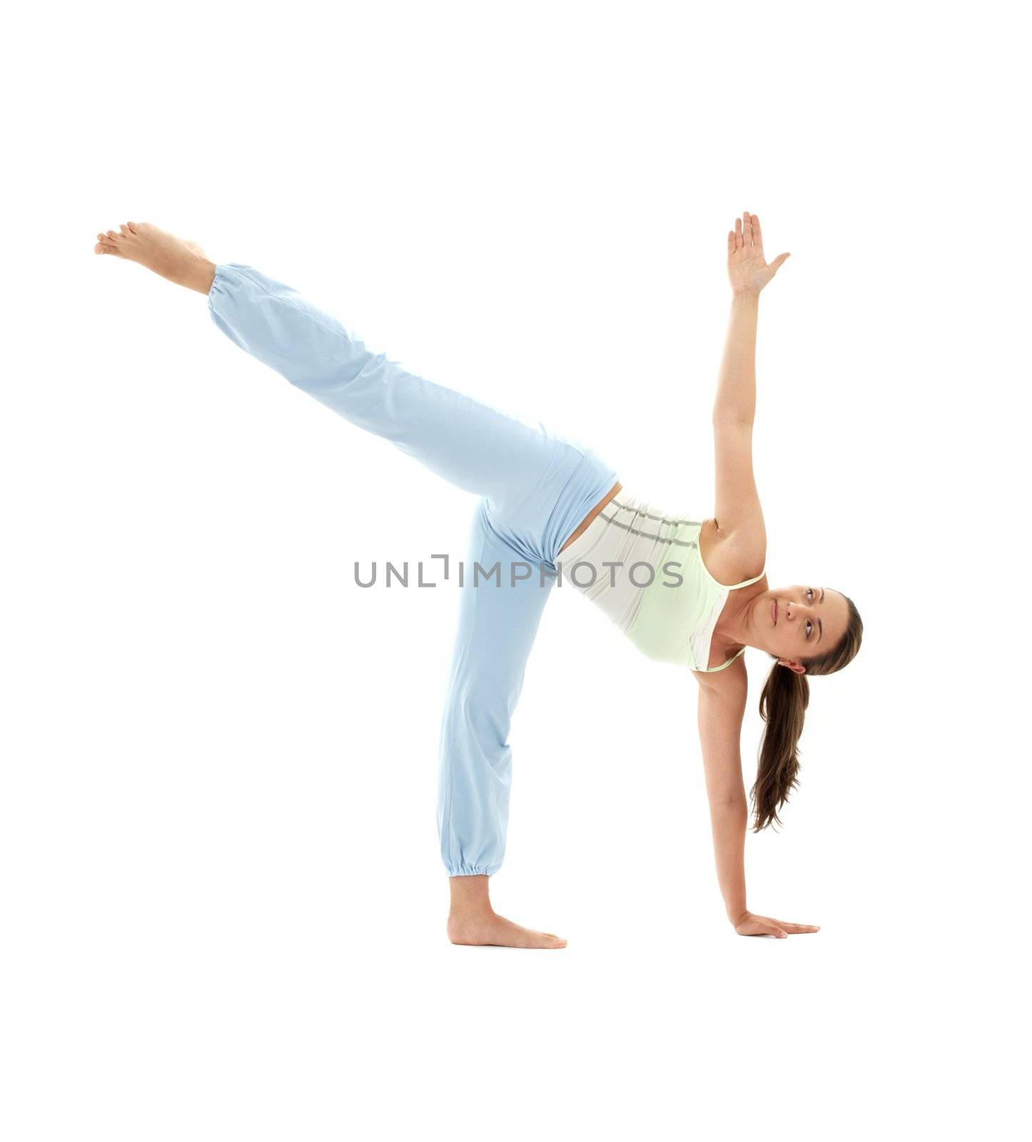 sporty girl practicing ardha chandrasana half moon pose