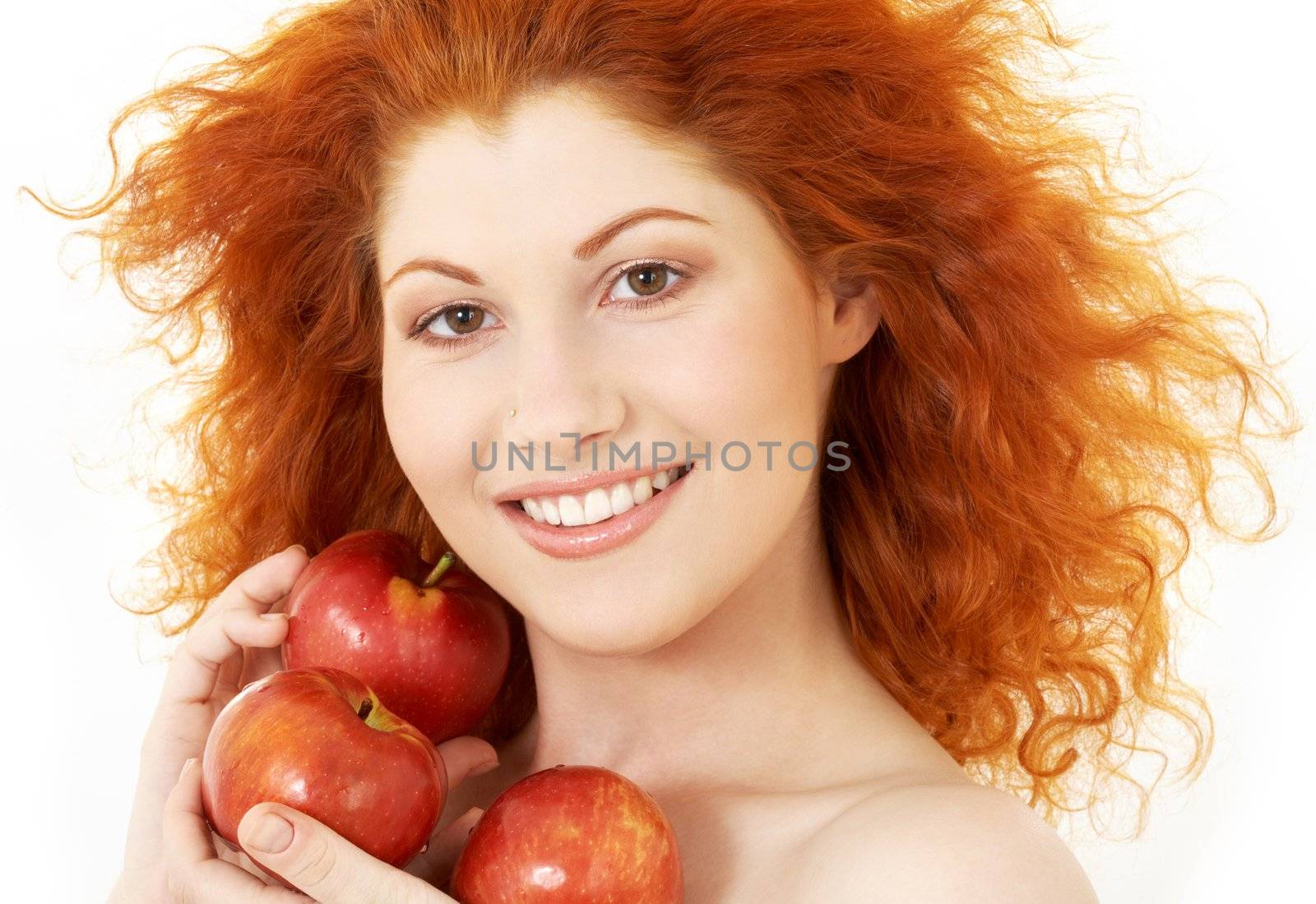 picture of happy redhead with red apples