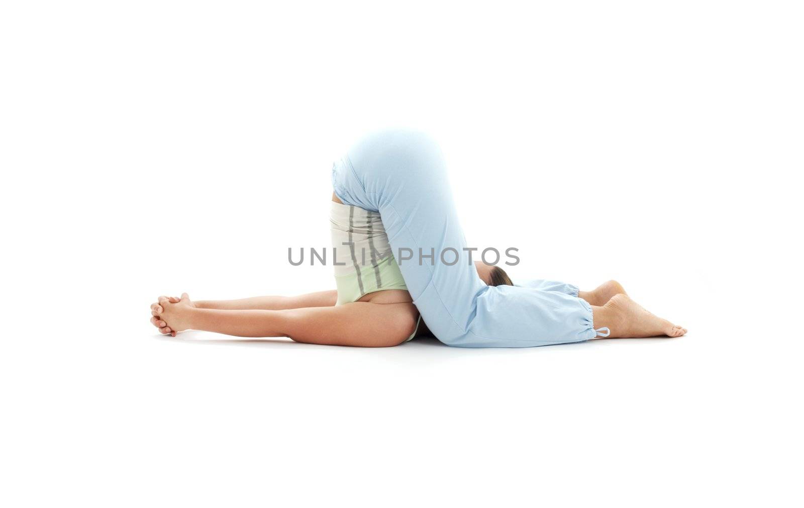 sporty girl practicing halasana plow pose